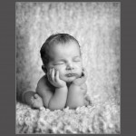 Baby photography glasgow newborn with head in hands