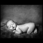 Baby photography glasgow newborn baby on fur blanket black and white