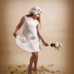 girl with flowers on cream background