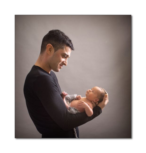 father with newborn baby girl