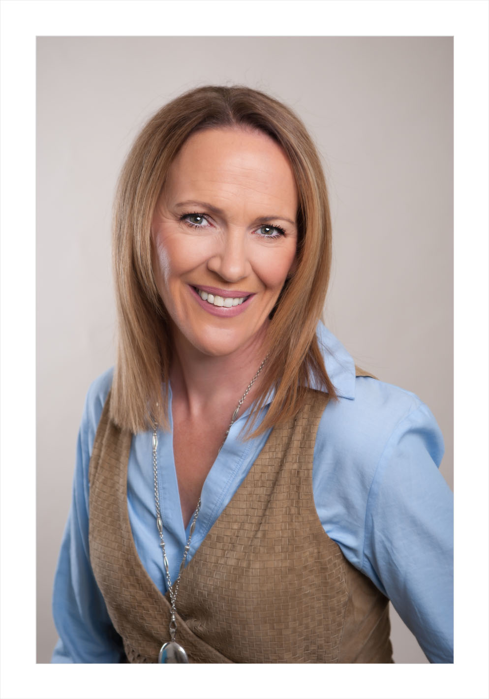 headshot, personal branding, close-up, woman in waistcoat, time management, what does your headshot say aabout you